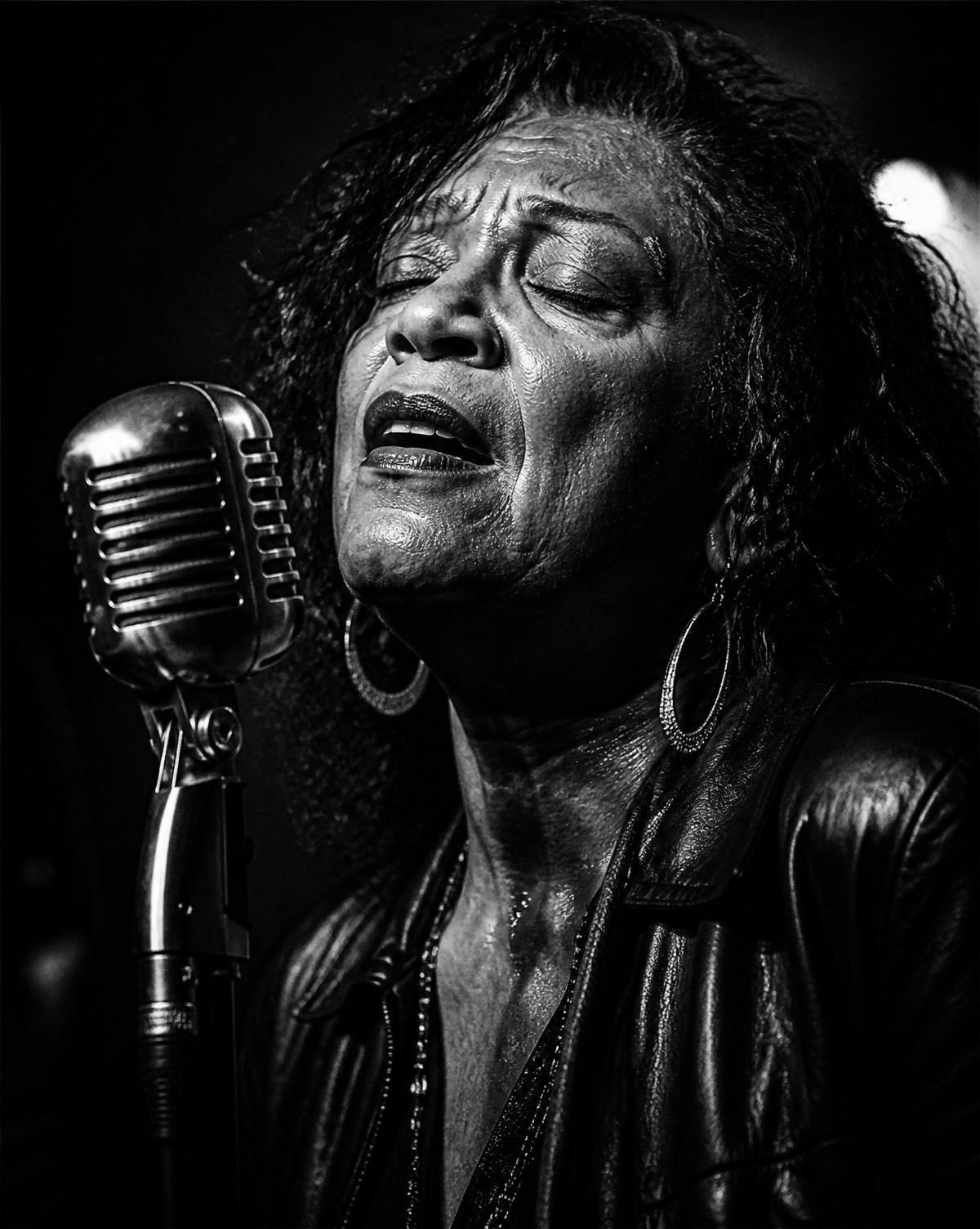 Artist performing at a vintage microphone